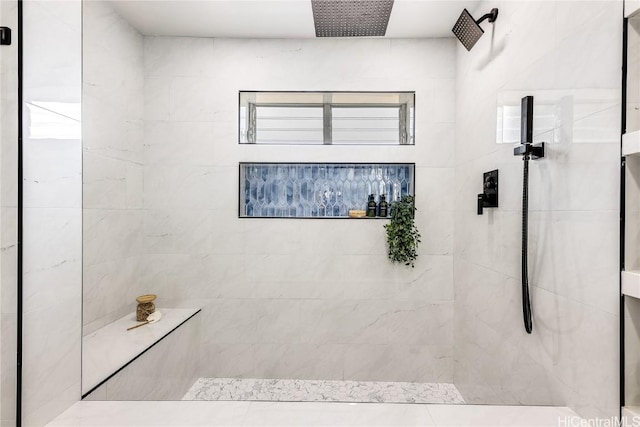 bathroom with tiled shower