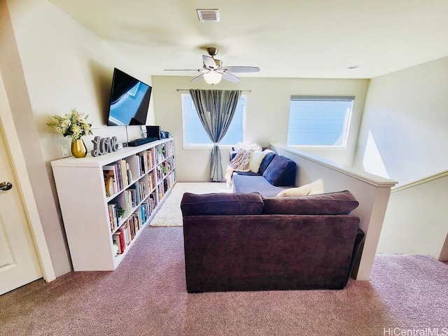 living room featuring carpet flooring and ceiling fan