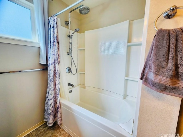 bathroom with shower / tub combo