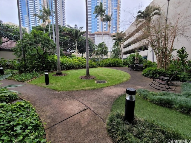 view of property's community featuring a yard