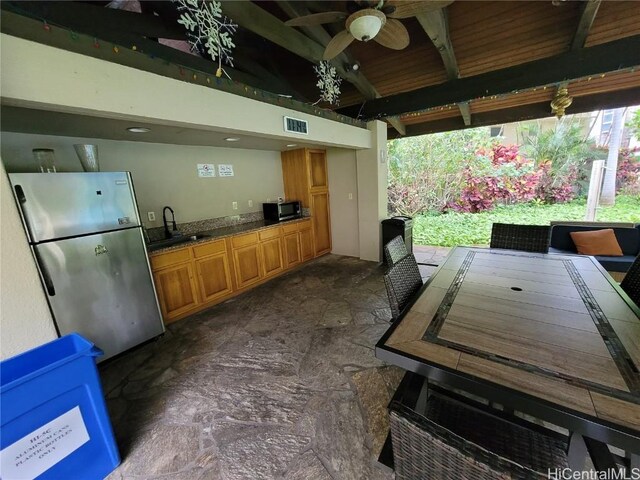 view of patio / terrace with area for grilling, ceiling fan, and sink