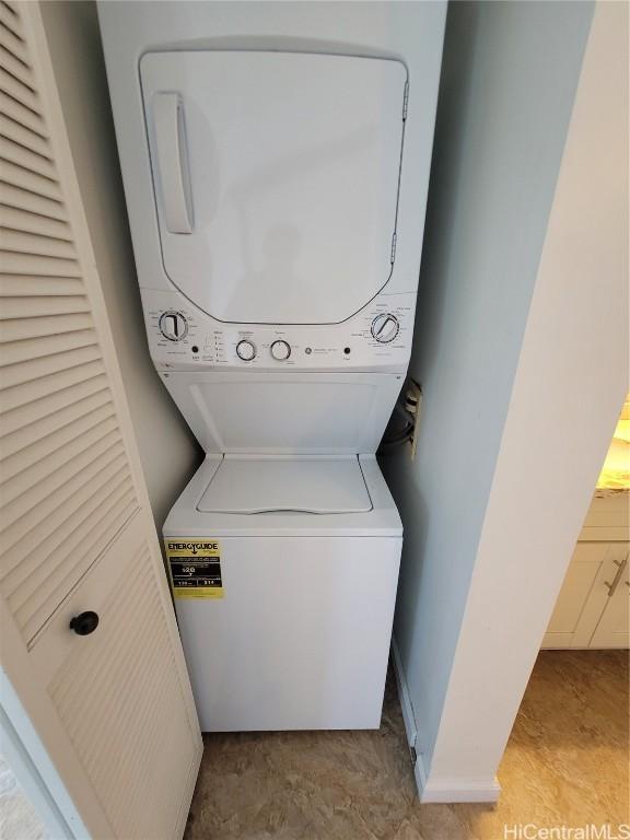 washroom with stacked washer and clothes dryer