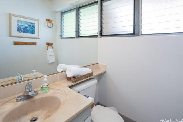 bathroom with vanity and toilet