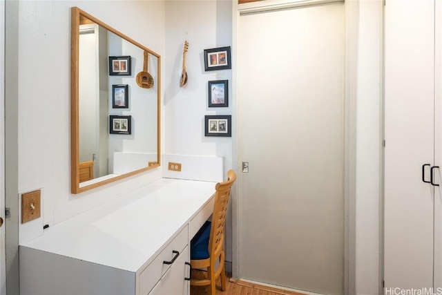 bathroom featuring hardwood / wood-style floors and vanity