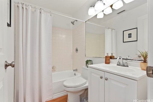 full bathroom with vanity, hardwood / wood-style floors, shower / bathtub combination with curtain, and toilet