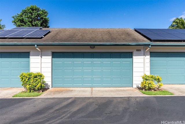 garage featuring solar panels