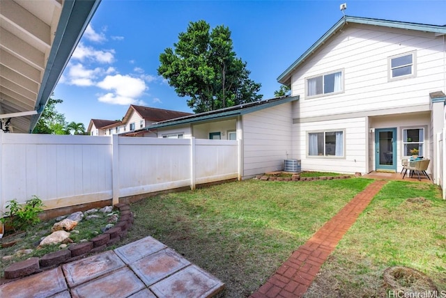 view of yard with a patio and central AC