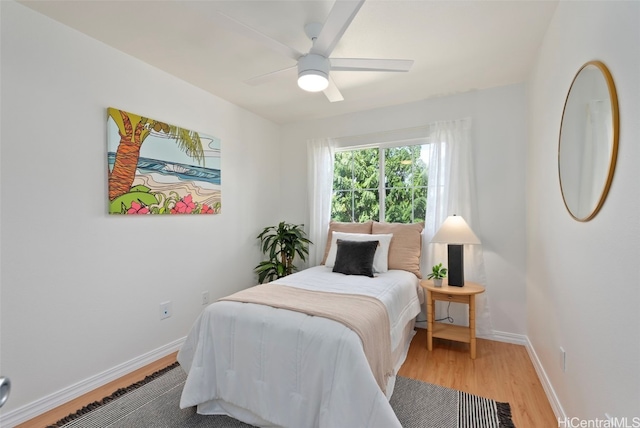 bedroom featuring hardwood / wood-style flooring and ceiling fan