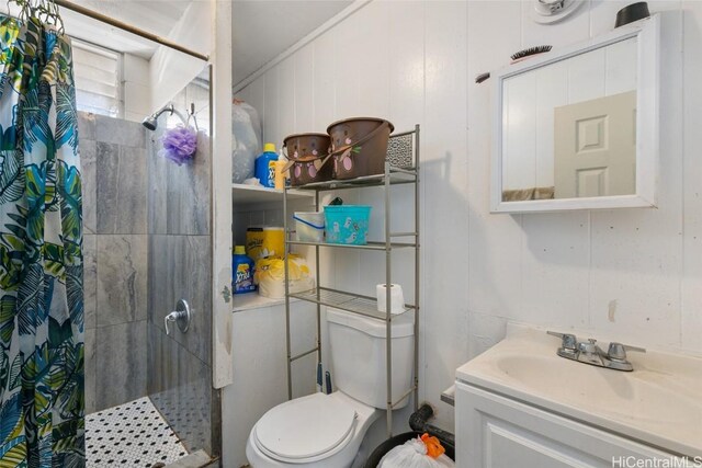 bathroom with a shower with curtain, vanity, crown molding, toilet, and wood walls