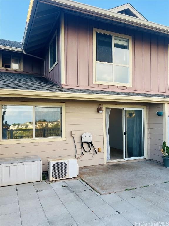 rear view of house featuring a patio area and ac unit