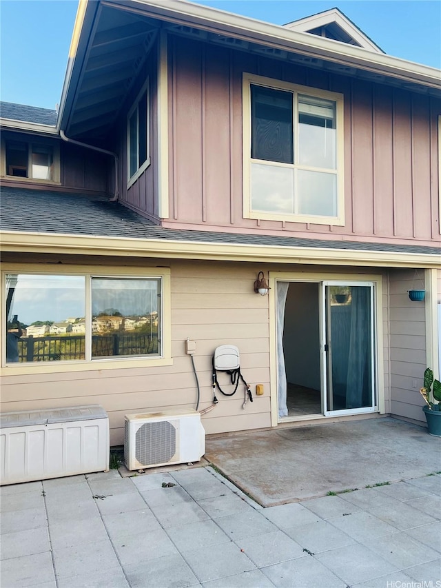 92-7139 Elele St Unit 805, Kapolei, HI 96707 - rear view of property featuring board and batten siding and a patio