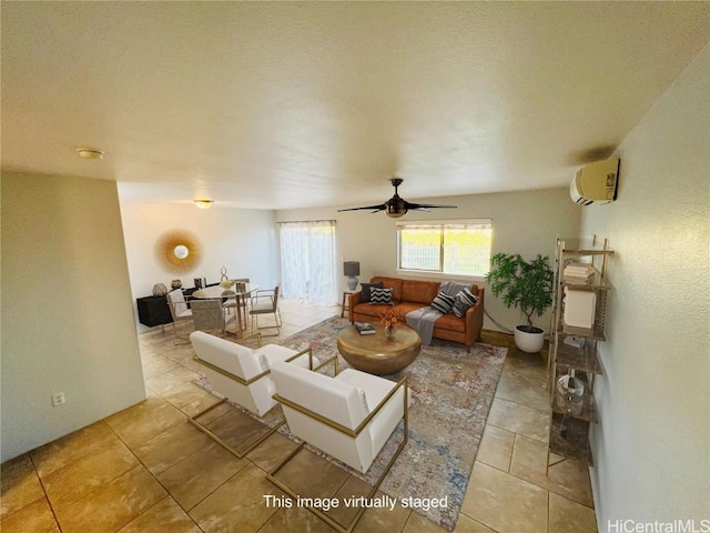 tiled living room featuring a wall mounted AC and ceiling fan