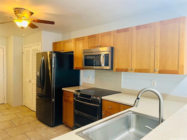 92-7139 Elele St Unit 805, Kapolei, HI 96707 - kitchen with stainless steel microwave, range with electric stovetop, black refrigerator with ice dispenser, a ceiling fan, and light countertops