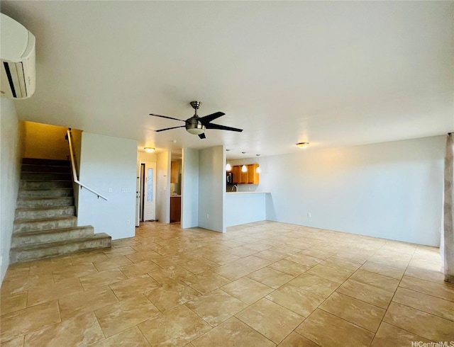 92-7139 Elele St Unit 805, Kapolei, HI 96707 - unfurnished living room featuring a wall mounted air conditioner, stairway, and ceiling fan