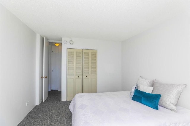 carpeted bedroom featuring a closet