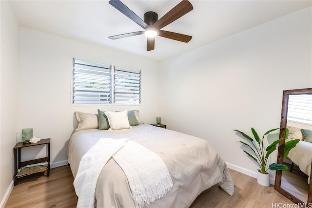 bedroom with ceiling fan and light wood-type flooring