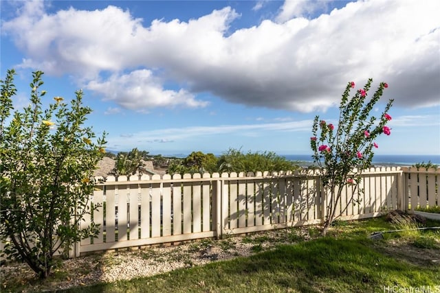 view of gate with a water view