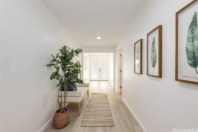 corridor featuring light hardwood / wood-style floors