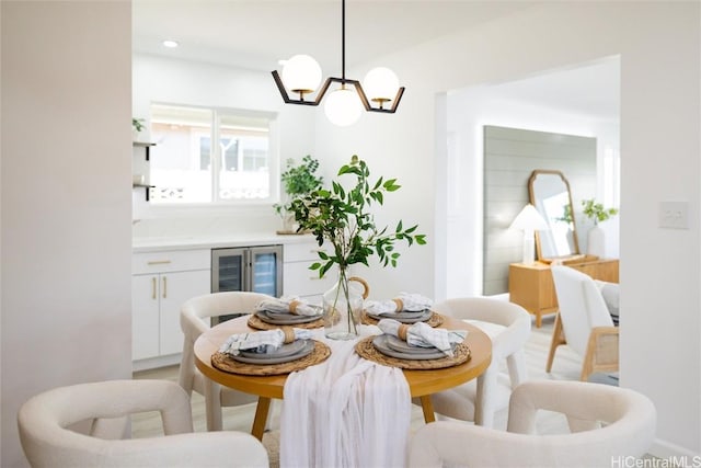 dining room with an inviting chandelier and beverage cooler