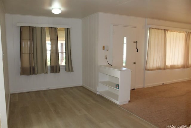 entryway with hardwood / wood-style floors