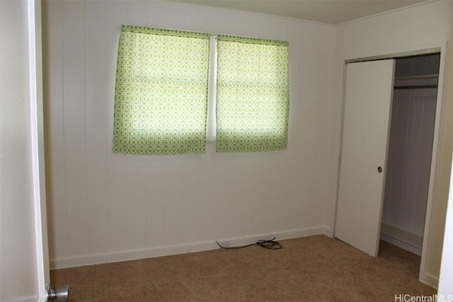 unfurnished bedroom featuring a closet and carpet