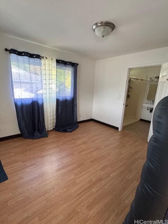 spare room with hardwood / wood-style flooring and a healthy amount of sunlight