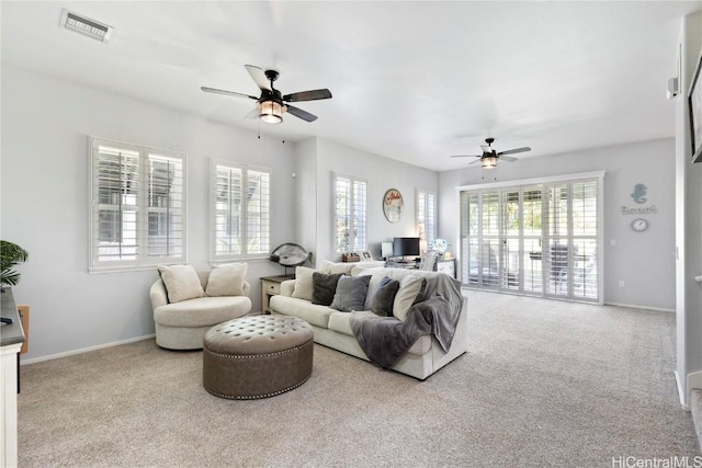 living room with ceiling fan and light carpet