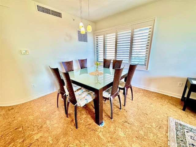 view of carpeted dining space