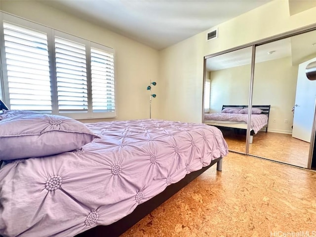 carpeted bedroom with a closet