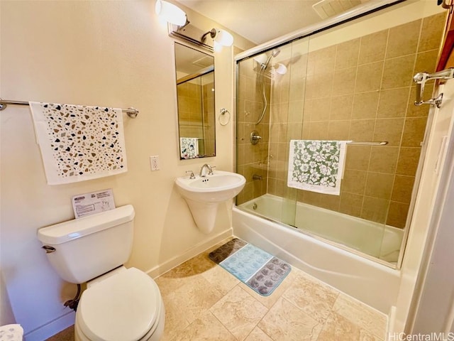 bathroom with toilet and enclosed tub / shower combo