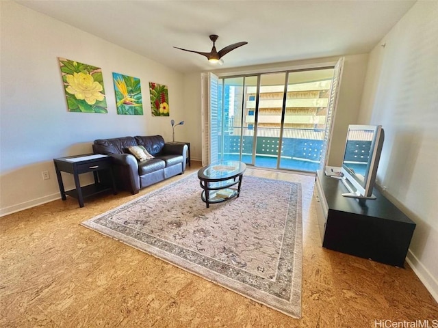 living room featuring carpet flooring and ceiling fan