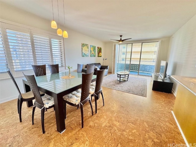 dining space with light carpet and ceiling fan