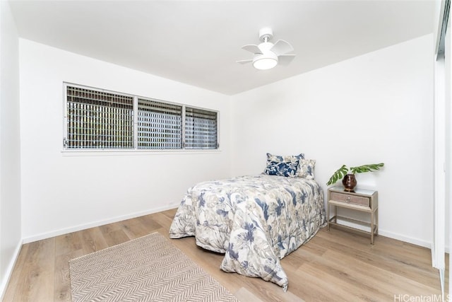 bedroom with hardwood / wood-style flooring and ceiling fan