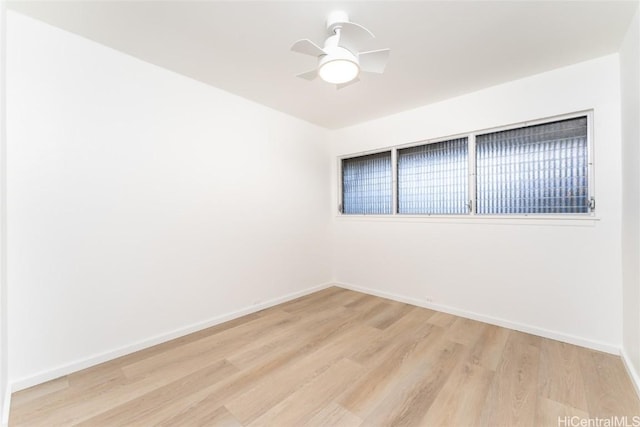 empty room featuring light hardwood / wood-style floors and ceiling fan