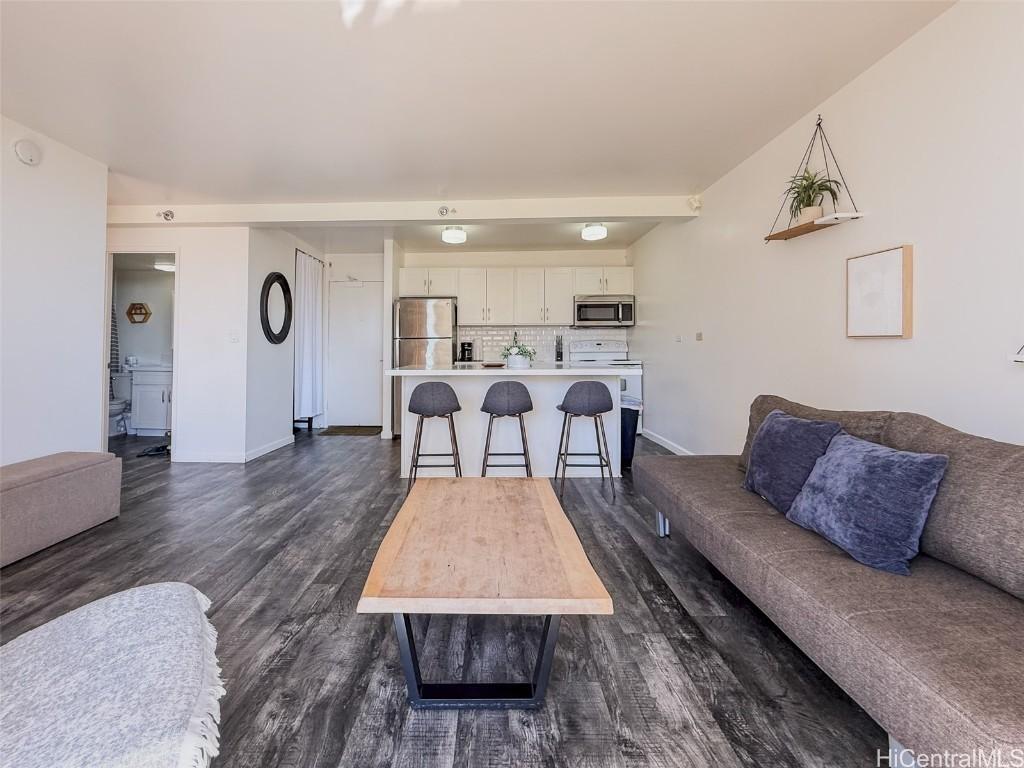 living room featuring dark hardwood / wood-style floors