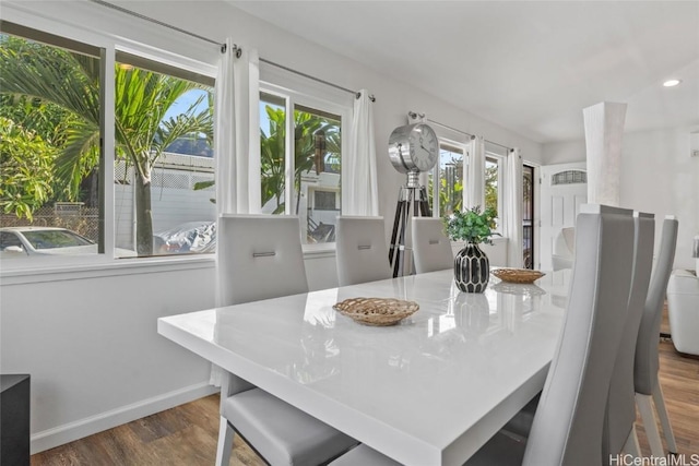 dining area with dark wood-type flooring