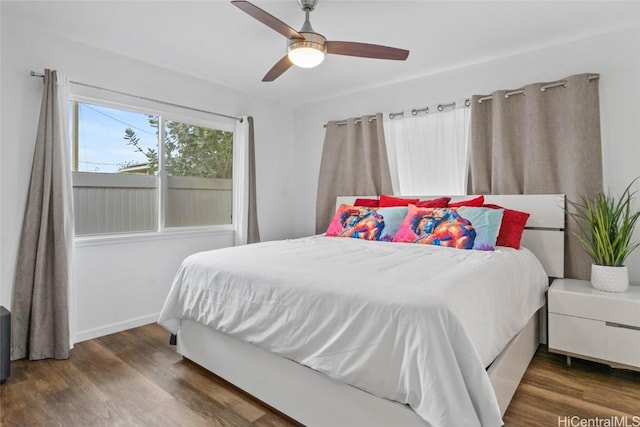 bedroom featuring ceiling fan and dark wood-type flooring