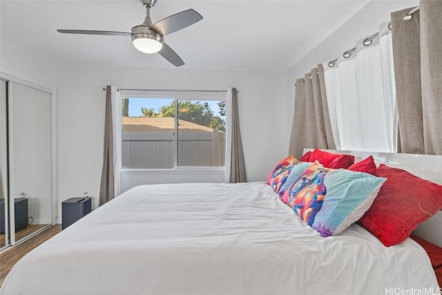 bedroom with hardwood / wood-style floors and ceiling fan