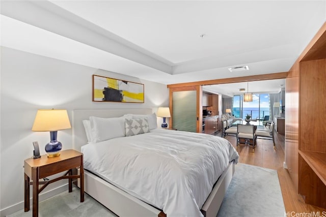 bedroom with light hardwood / wood-style floors