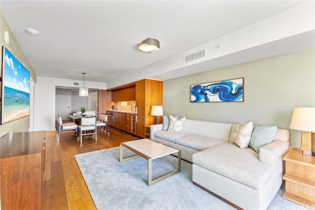 living room with dark hardwood / wood-style floors