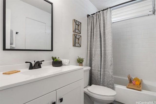 full bathroom with shower / bath combination with curtain, toilet, and vanity