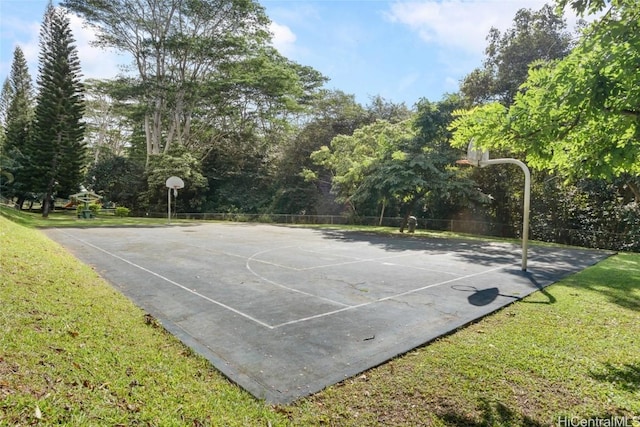 view of basketball court featuring a yard