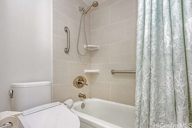 bathroom with shower / bathtub combination with curtain