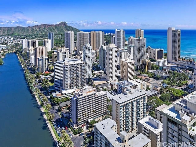 birds eye view of property featuring a water and mountain view