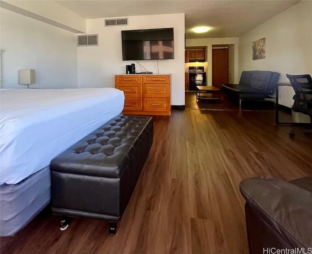 bedroom featuring dark hardwood / wood-style flooring