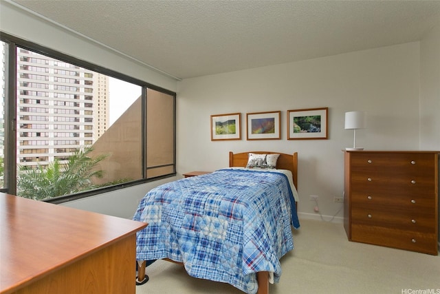 1778 Ala Moana Blvd Unit 1217, Honolulu, HI 96815 - carpeted bedroom with a textured ceiling and baseboards