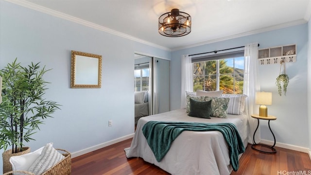 bedroom with dark hardwood / wood-style flooring and crown molding