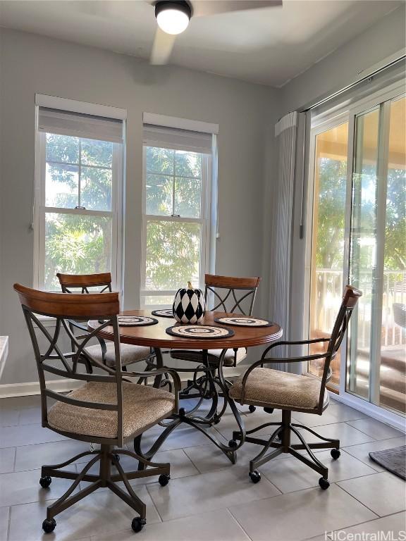 tiled dining area with a healthy amount of sunlight