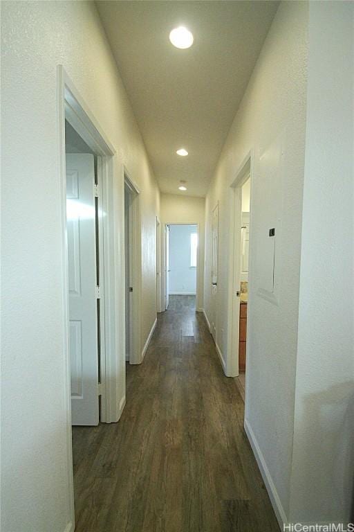 corridor featuring dark hardwood / wood-style floors