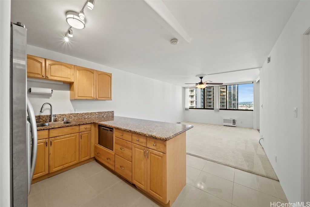 kitchen with light carpet, sink, ceiling fan, stainless steel fridge, and kitchen peninsula